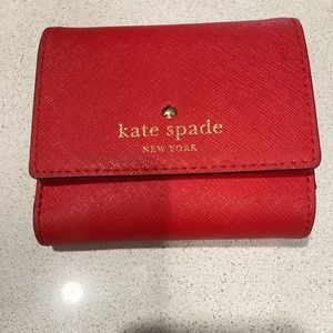 Red wallet with coin department.